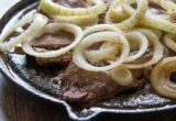 The Science of the Sizzle: Can Raw Onions Actually Tenderize Your Steak?