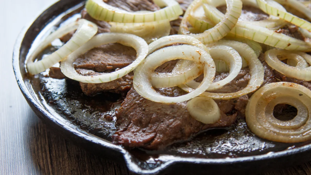 The Science of the Sizzle: Can Raw Onions Actually Tenderize Your Steak?
